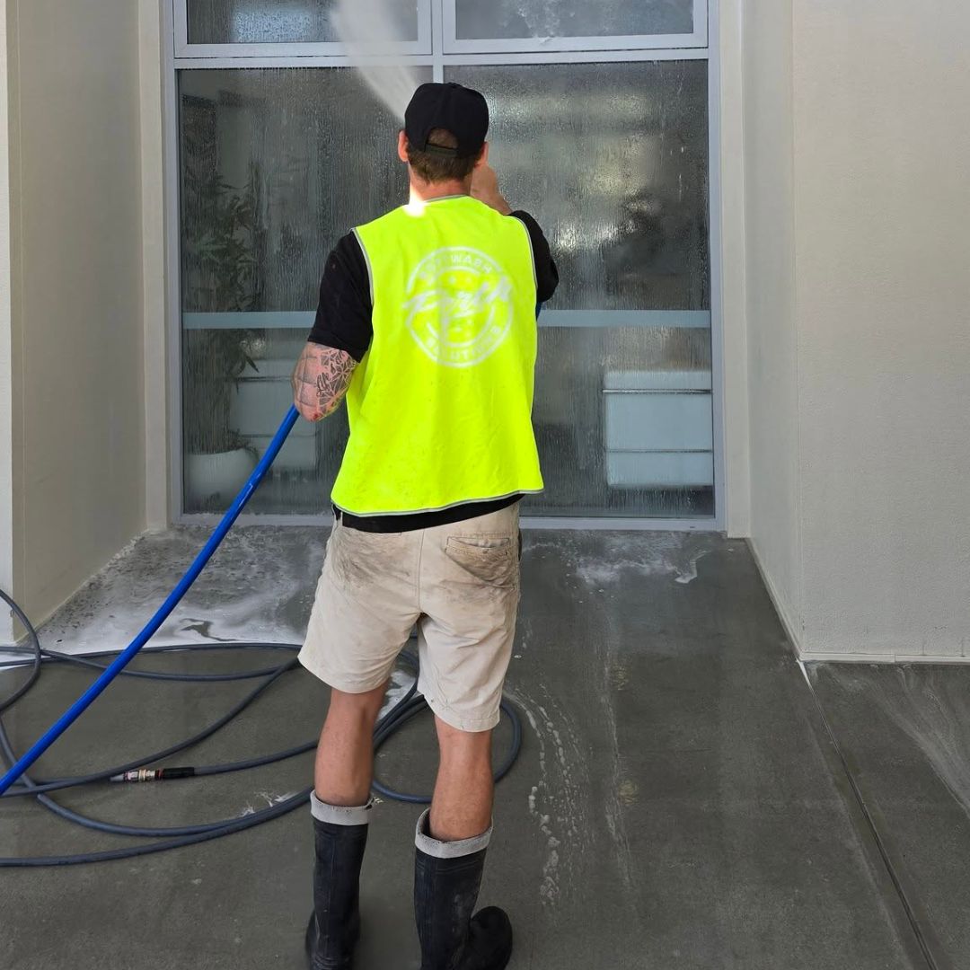 Pressure washing a storefront